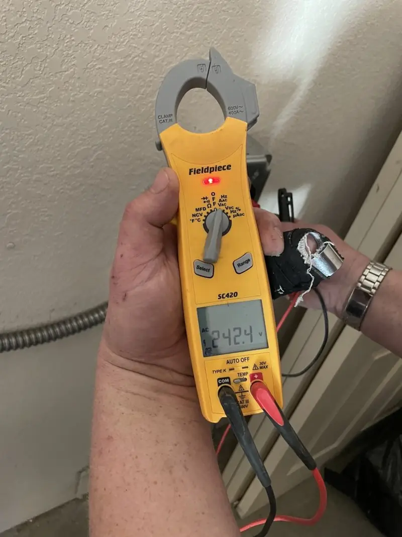 Voltage testing with clamp meter during Outlet Installation in Middleton